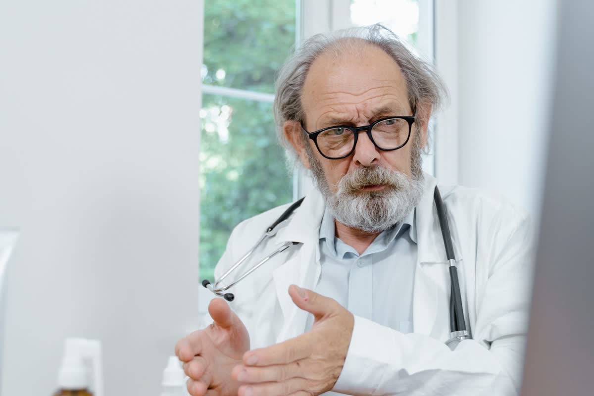 A doctor speaking during an online consultation